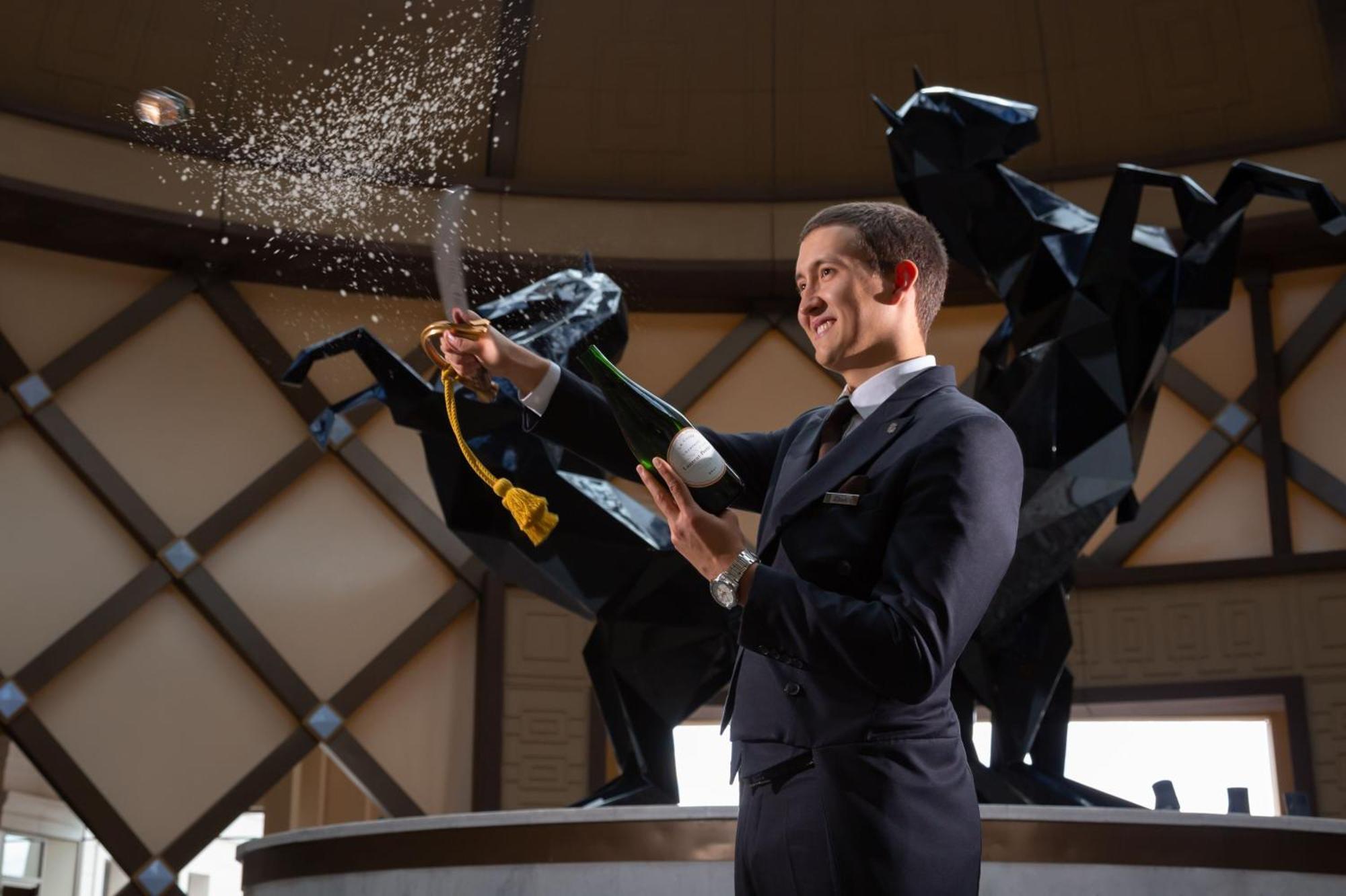 The St. Regis Astana Hotel Exterior photo A butler at the Atlantis Resort, Bahamas