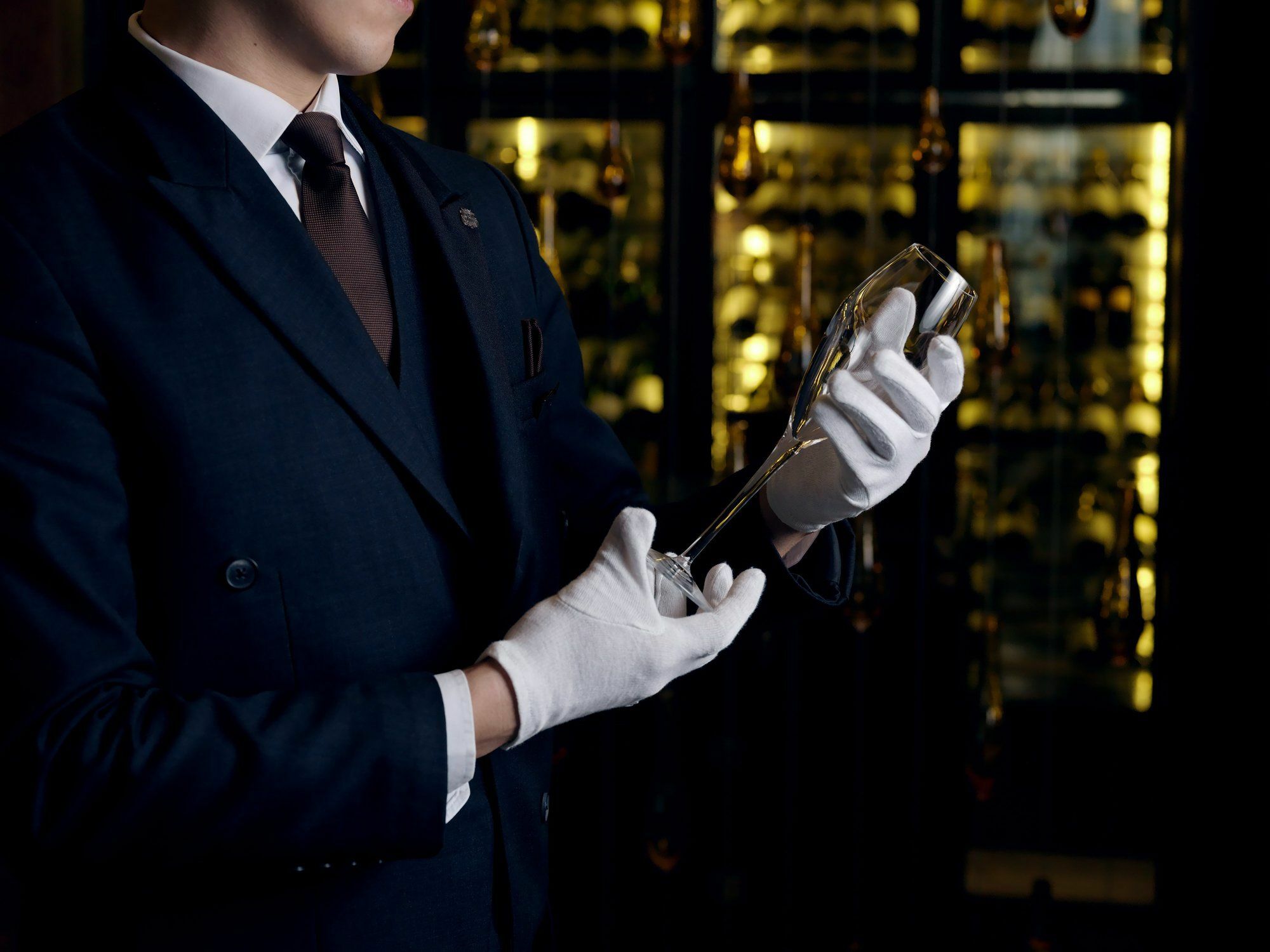 The St. Regis Astana Hotel Exterior photo A sommelier inspecting a bottle of wine